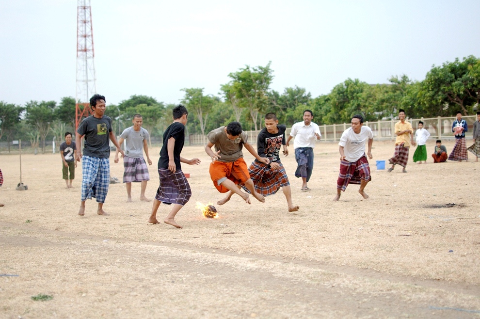 ***EXCLUSIVE*** KEDIRI, INDONESIA - OCTOBER 7: Students play Fire Football at the boarding school Lirboyo on October 7, 2012 in Kediri, Indonesia. THE PREMIER League boasts some of the hottest stars in the world – but they’ve got nothing on these fiery