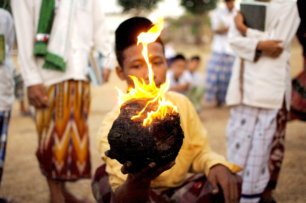 ***EXCLUSIVE*** KEDIRI, INDONESIA - OCTOBER 3: Students play Fire Football at the boarding school Lirboyo on October 3, 2012 in Kediri, Indonesia. THE PREMIER League boasts some of the hottest stars in the world – but they’ve got nothing on these fiery